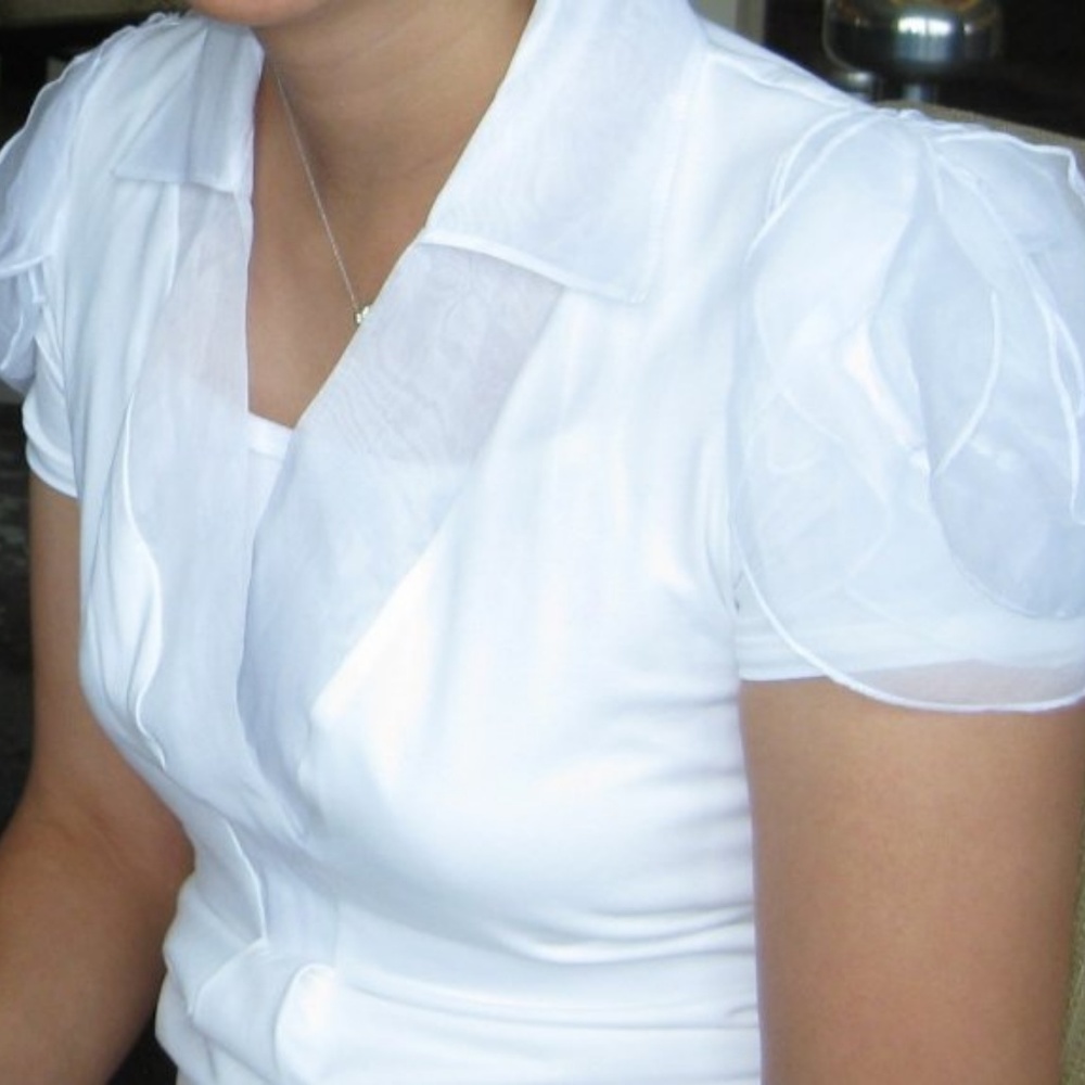 Anne Fontaine white top; "organza rosette" sleeves